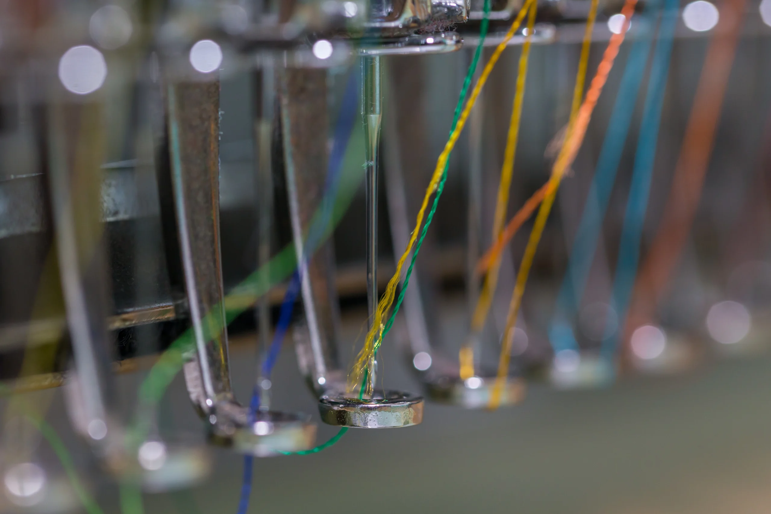 VistaCreate-225822558-stock-photo-embroidery-machine-needle-textile-industry-garment-manufacturers-embroidery-needle-needle